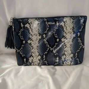 GiGi New York navy Uber python clutch.
Never used & smoke free home.
